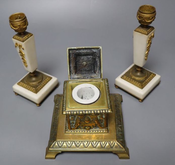 A pair of ormolu mounted alabaster candlesticks, 18cm and a cast brass inkwell with ceramic liner, 14cm wide